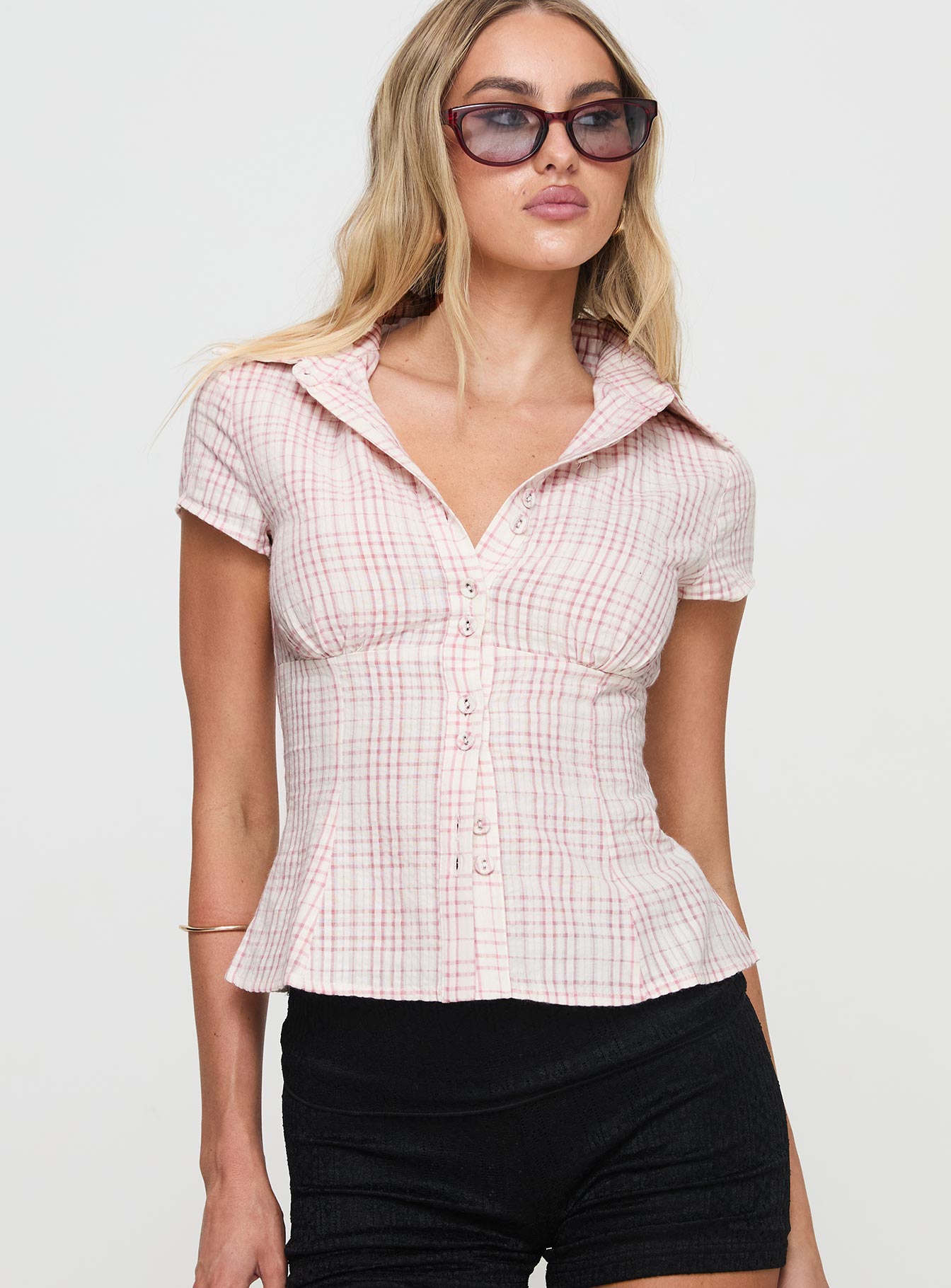 front view of model wearing Princess Polly Cottesloe Blouse Top Pink Check Short Sleeves V-Neck