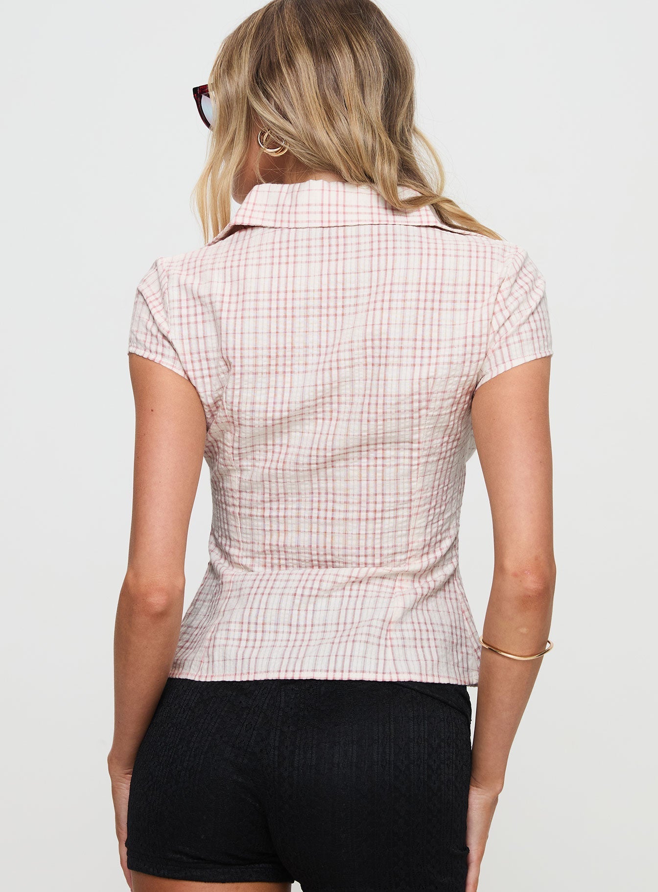 back view of model wearing Princess Polly Cottesloe Blouse Top Pink Check Short Sleeves V-Neck